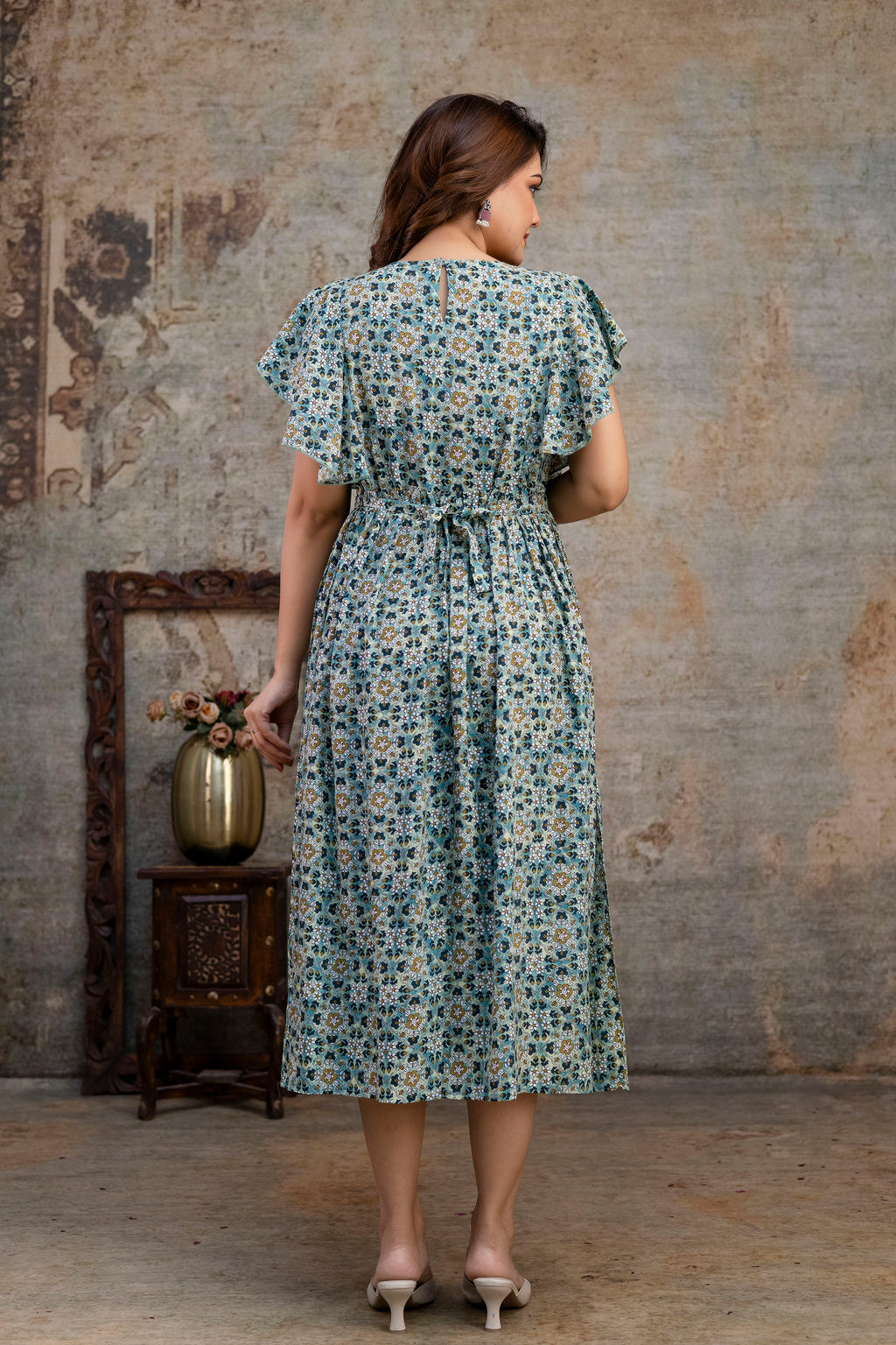 Back view of grey printed nursing dress and gathered waist seam
