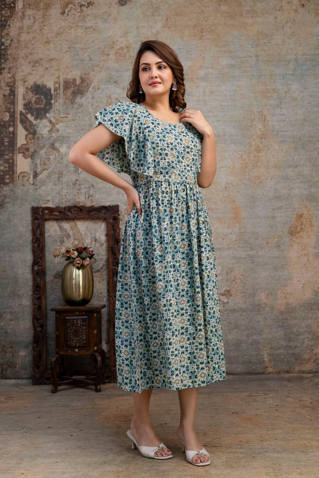 Angled view of grey printed nursing dress with a flared skirt