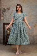 Front view of grey printed nursing dress with flutter sleeves and a gathered waist