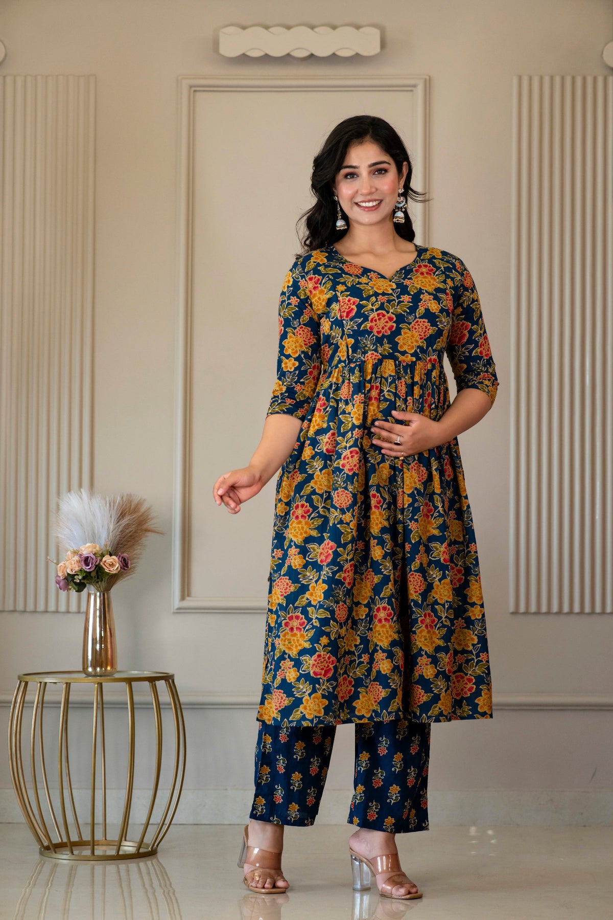 Angled front view of blue floral kurta and printed palazzo trousers