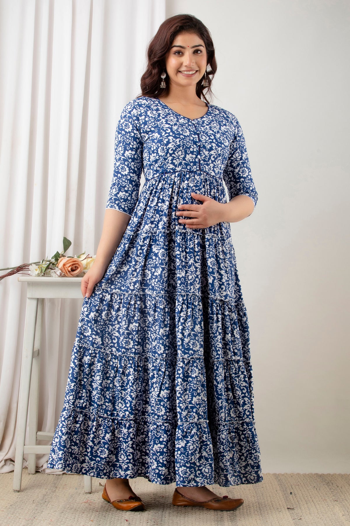 HENAL G-H378 blue and white floral maternity gown, full-length angled front view.