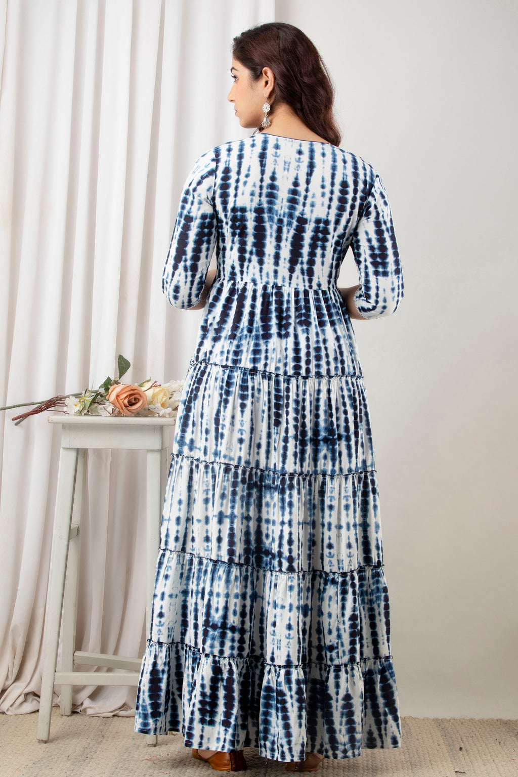 HENAL G-H380 blue and white tie-dye maternity gown: rear three-quarter standing view showing back, sleeves and tiered skirt.