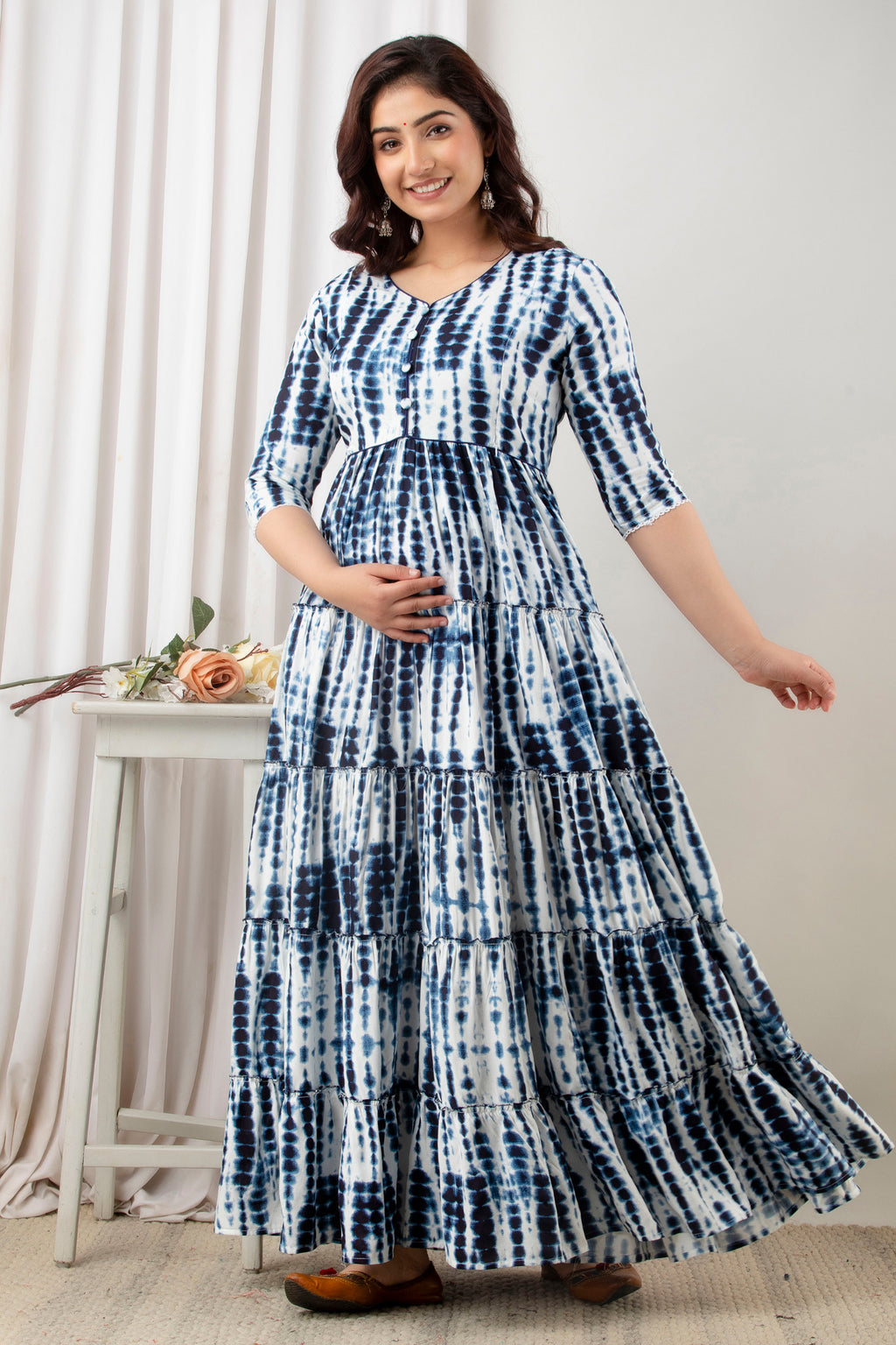 HENAL G-H380 blue and white tie-dye maternity gown: angled full-length view with one arm extended.