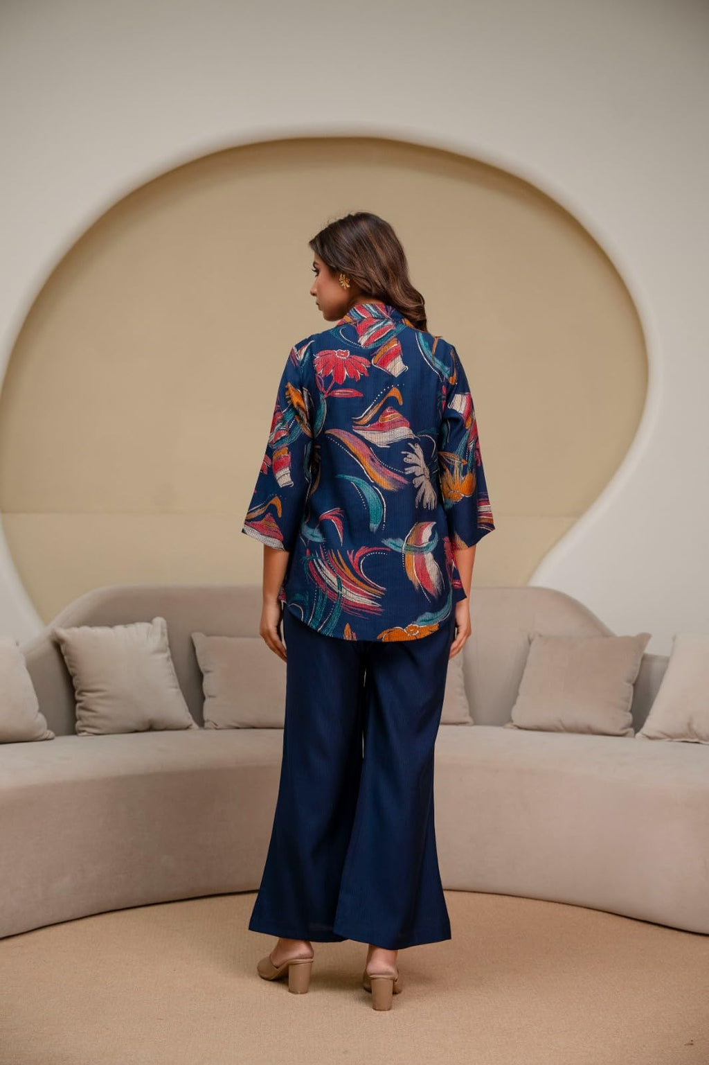Back view of navy floral top and wide-leg trousers