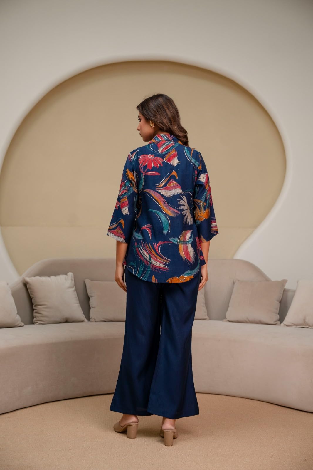 Back view of navy floral top and wide-leg trousers