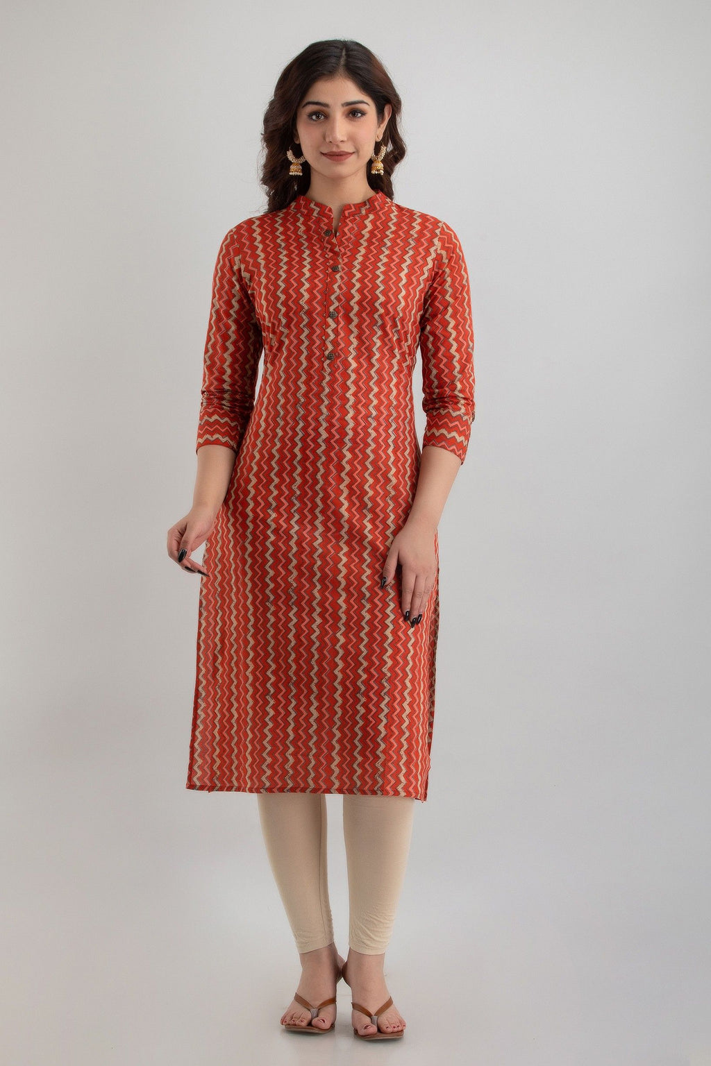 HENAL H311 garment showing orange zigzag print, straight silhouette, three-quarter sleeves.