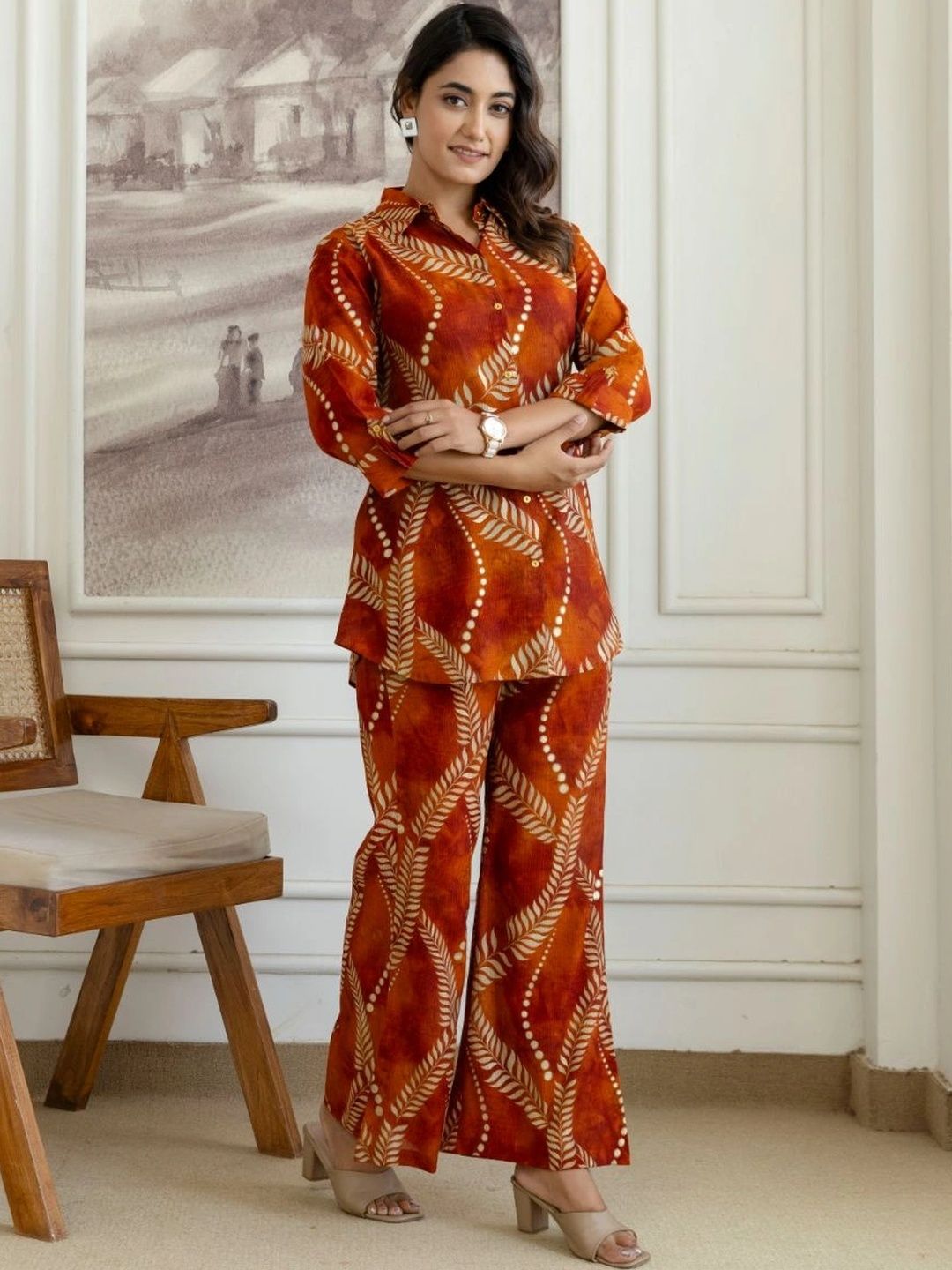 HENAL H2514 Rust co-ord set. Full-length front view with arms folded.