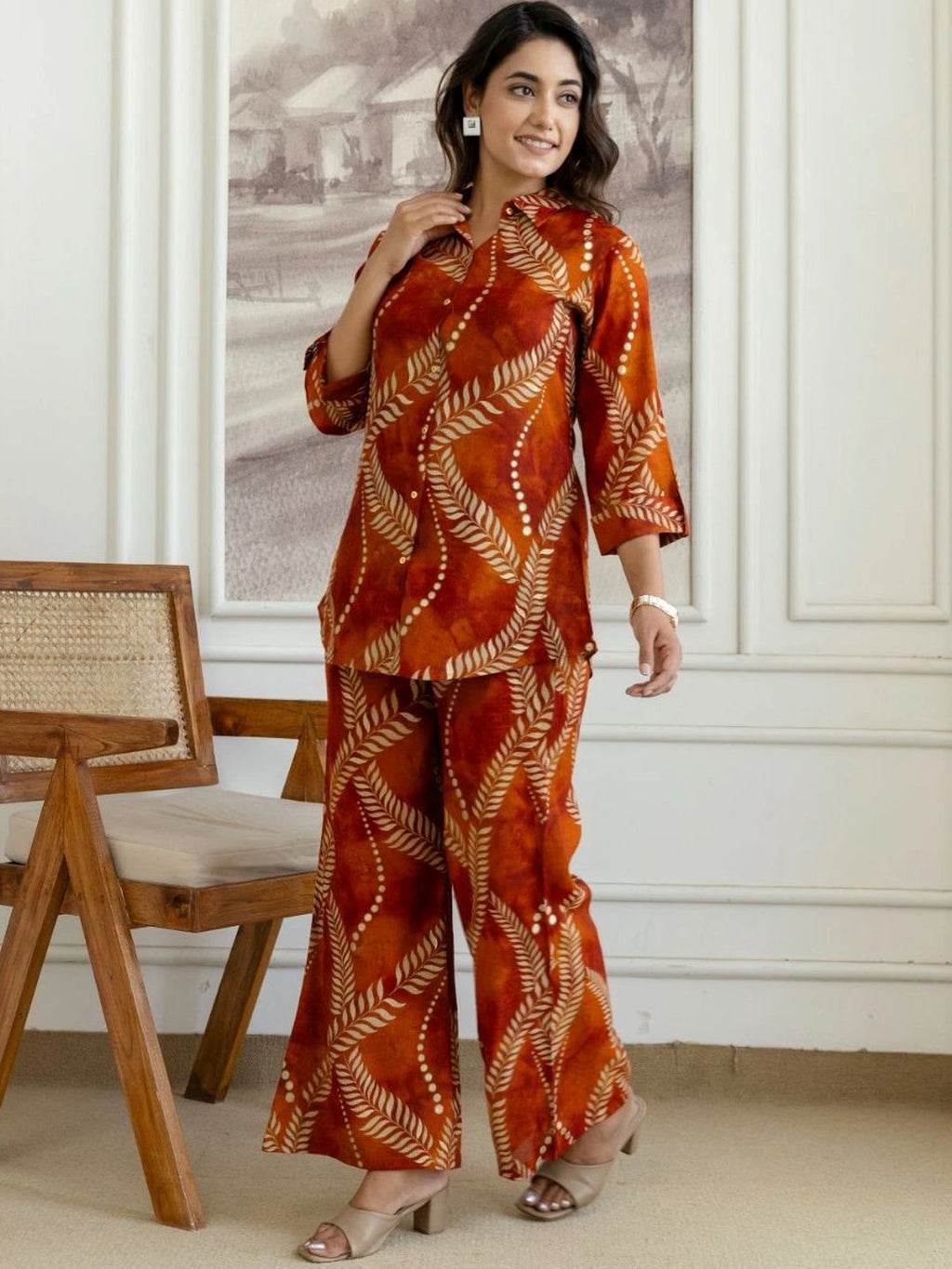 HENAL H2514 Rust co-ord set. Full-length angled view of rust leaf-print co-ord set.