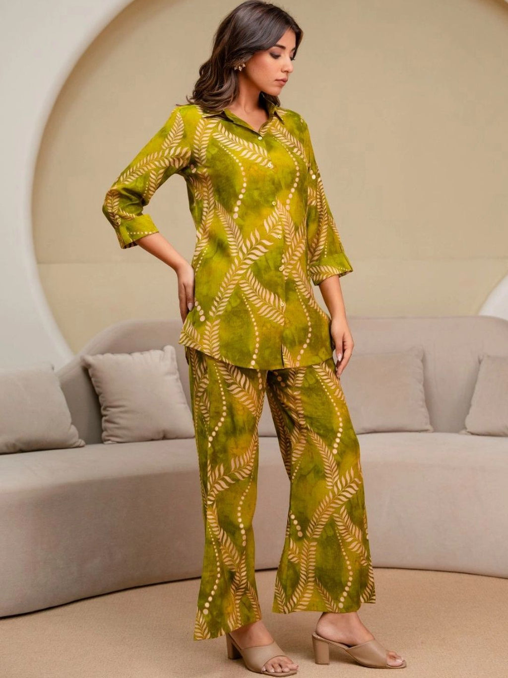 HENAL H2515 Olive co-ord set. Full-length angled view with one hand at waist.