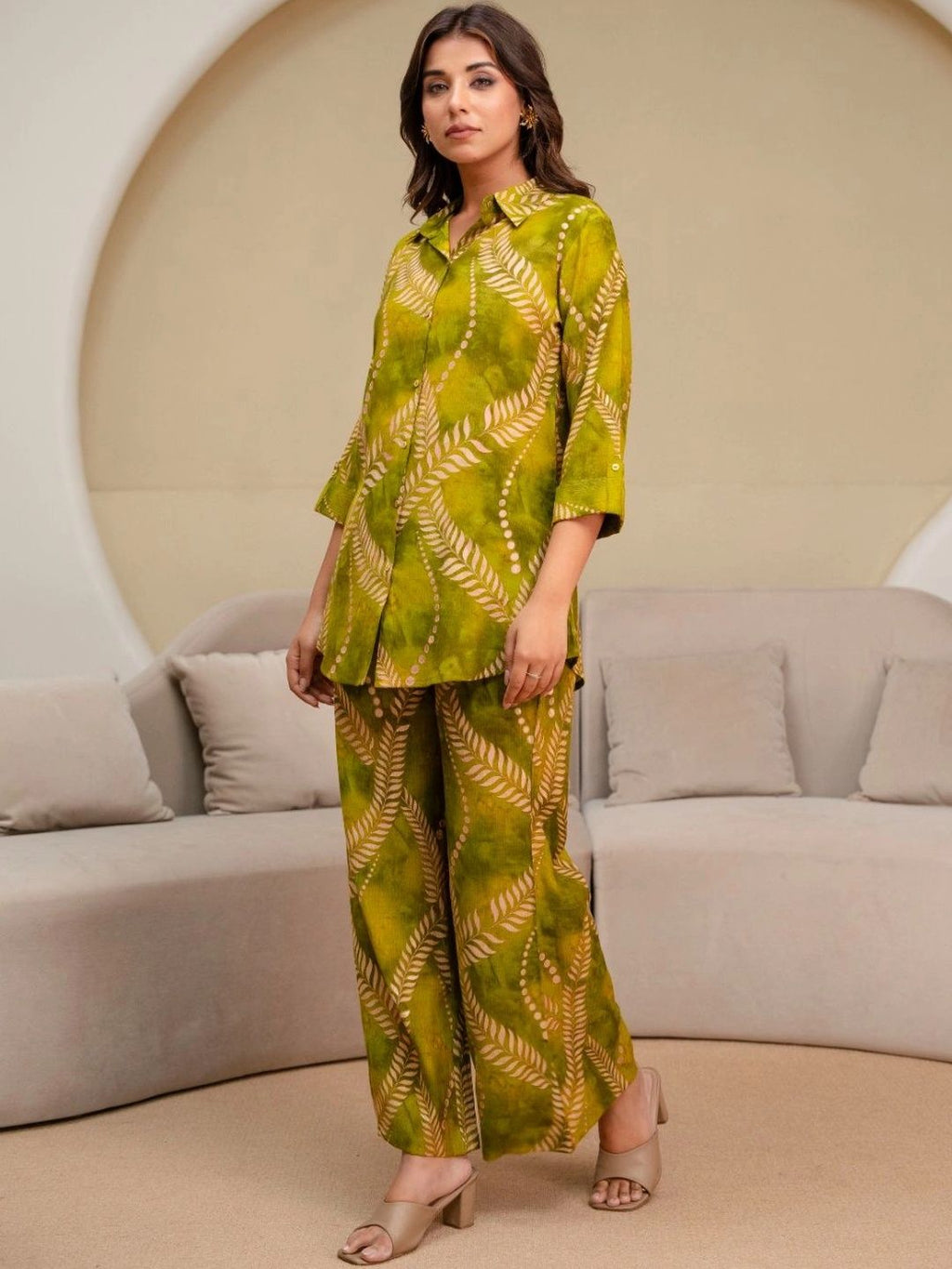 HENAL H2515 Olive co-ord set. Full-length angled view of green leaf-print co-ord set.