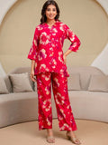 HENAL H2516 Pink co-ord set. Full-length front view of pink floral shirt and trousers.