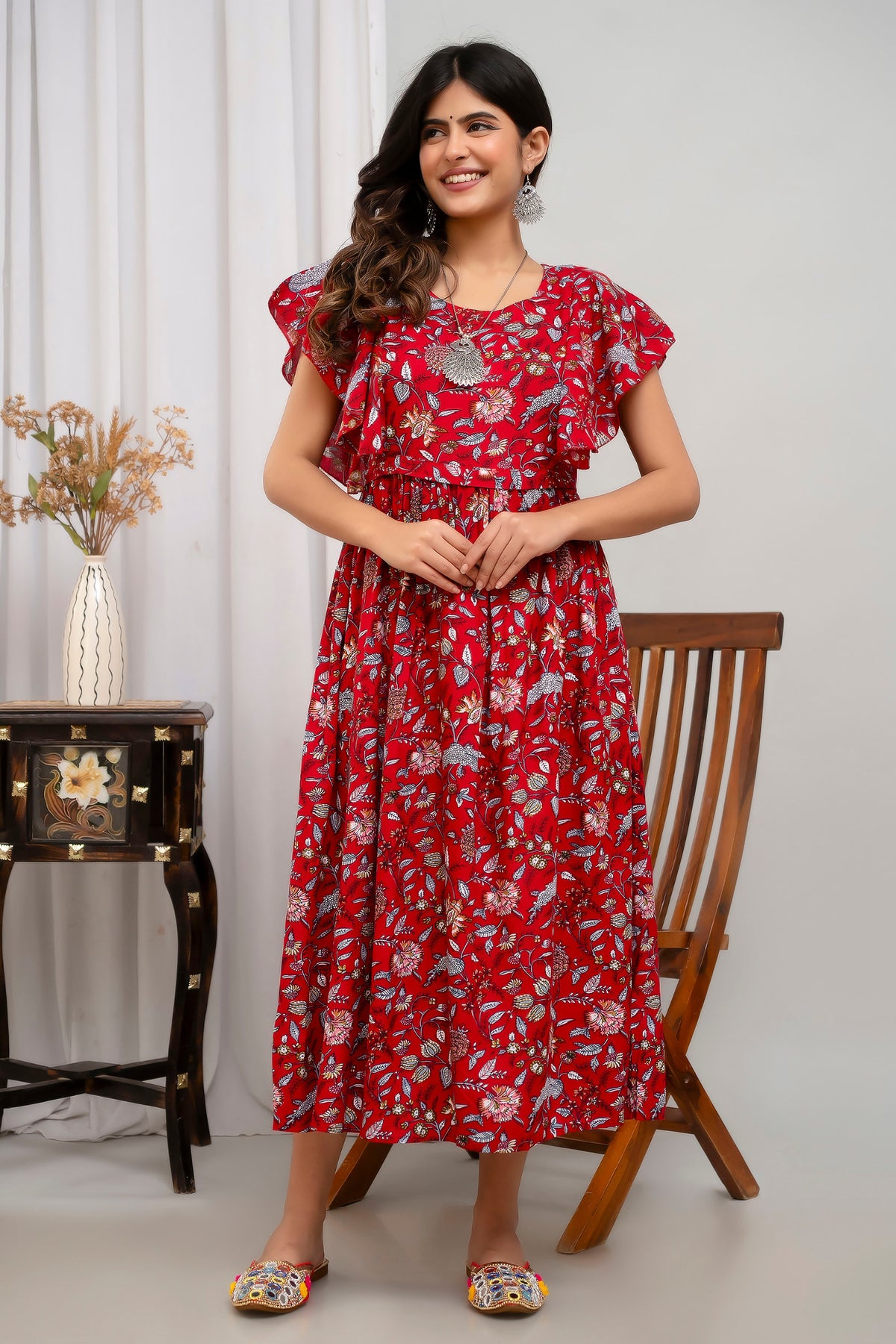HENAL H391 Red floral maternity kurti, full-length front view showing round neckline, flutter sleeves and gathered skirt.