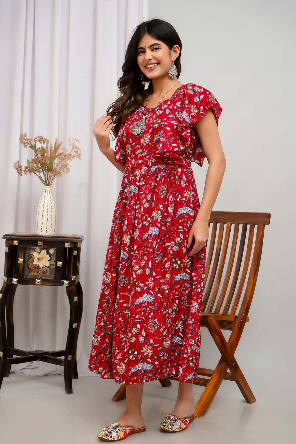 HENAL H391 Red floral maternity kurti, full-length three-quarter view showing flutter sleeves and waist detail.