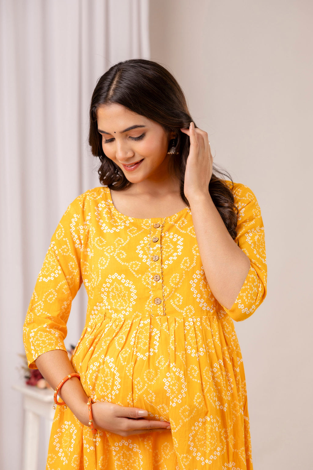 HENAL PK52 Yellow maternity and nursing kurta: upper-body maternity view showing neckline, sleeve and waist.