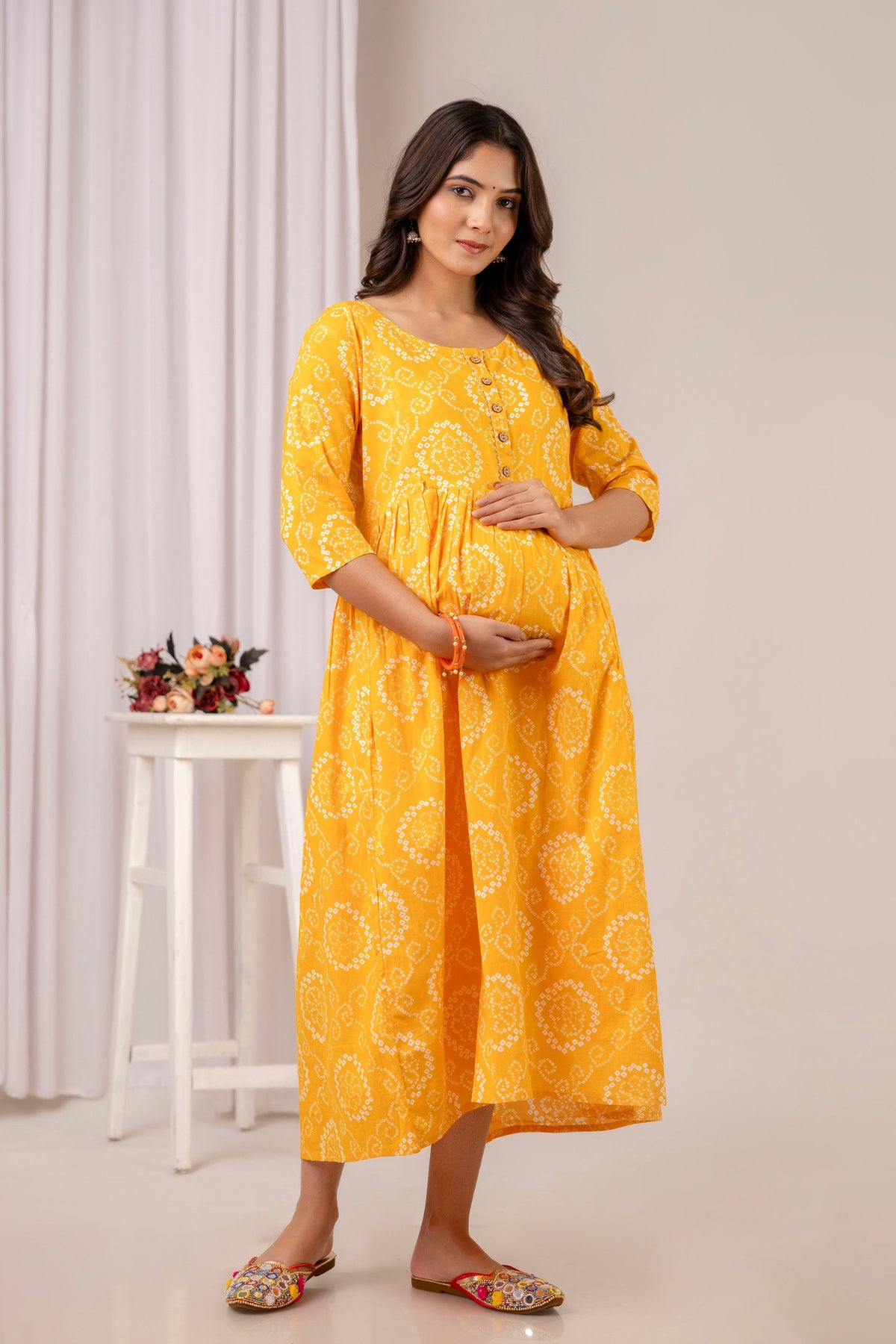 HENAL PK52 Yellow maternity and nursing kurta: full-length front three-quarter maternity pose.