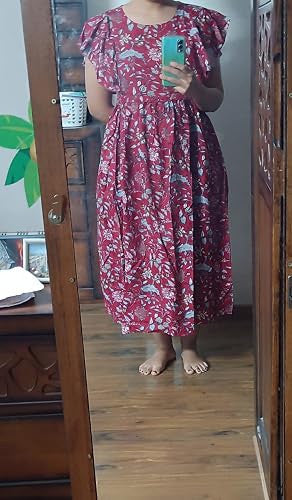 Mirror photo showing a red floral dress