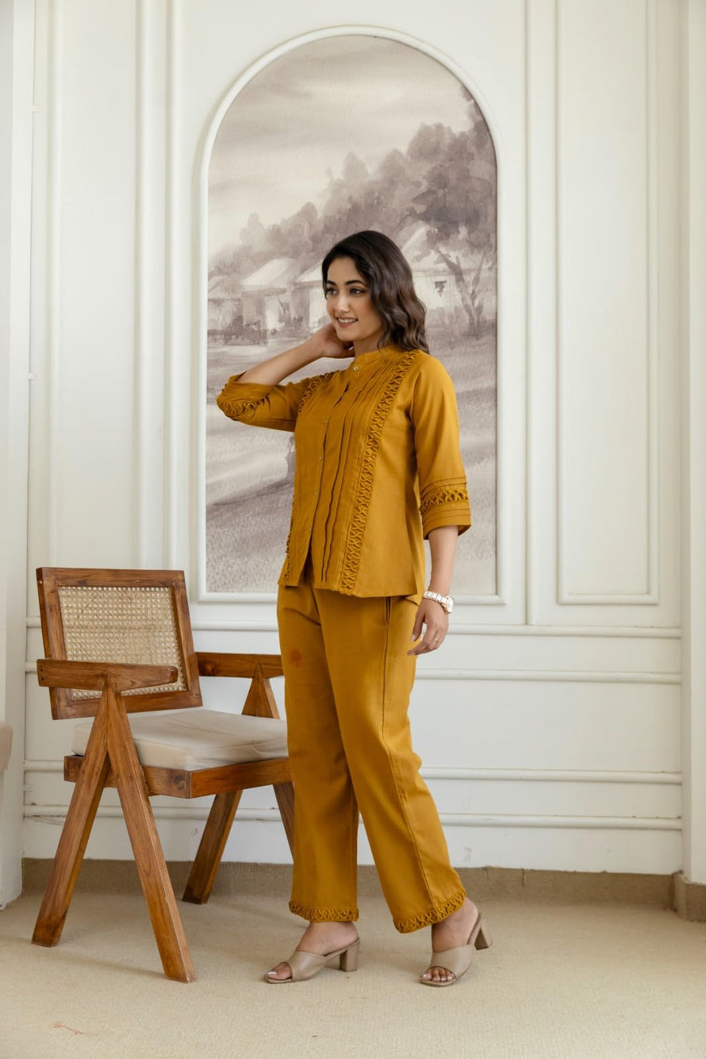 Full-length front view of mustard pintuck and cutwork co-ord set